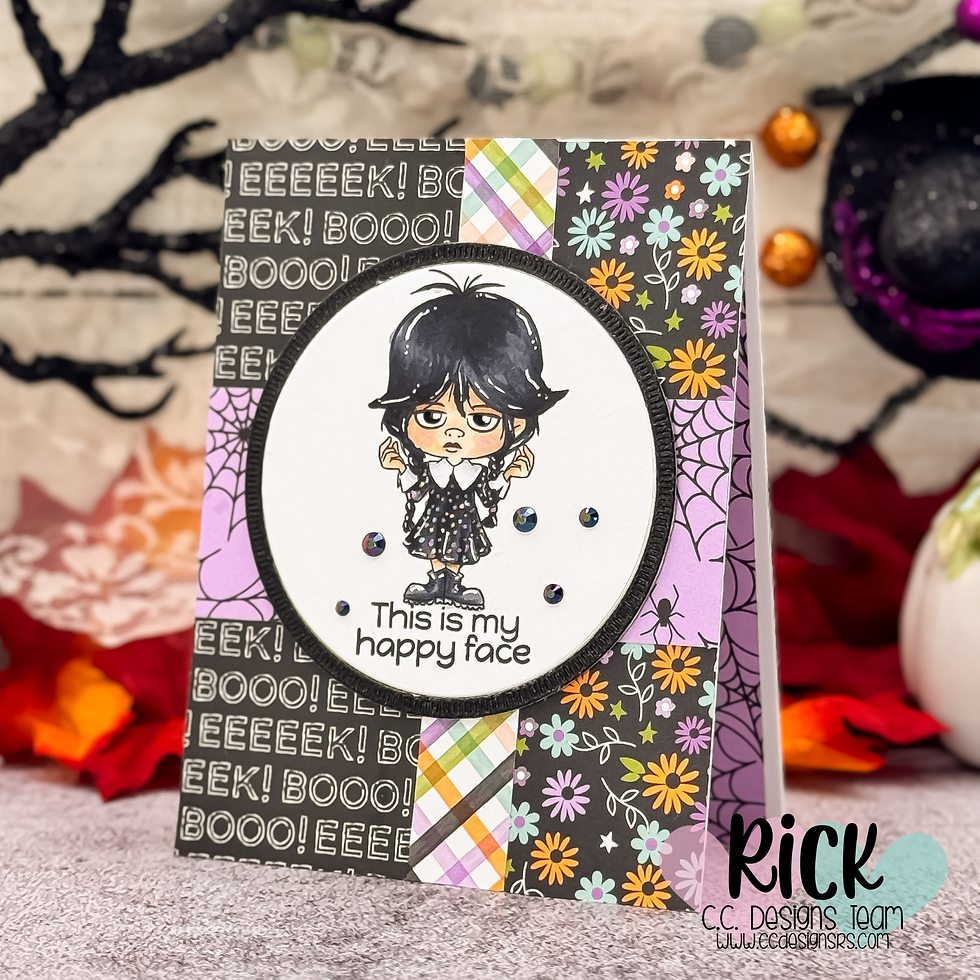 Halloween-themed card featuring a girl in black and white, surrounded by colorful floral and patterned designs. Text says "This is my happy face."