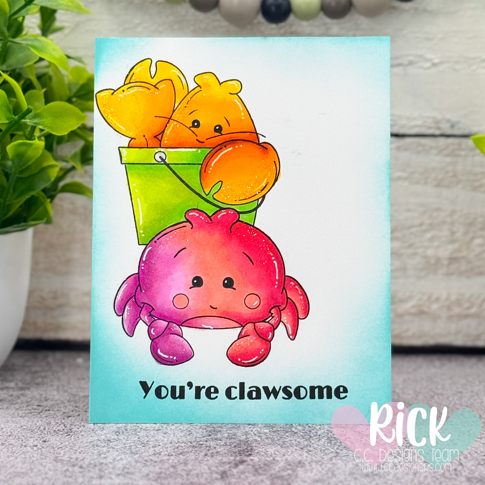 Cute pink crab and orange clawed creatures in a green bucket on a card. Text reads "You're clawsome." Green plant in the background.