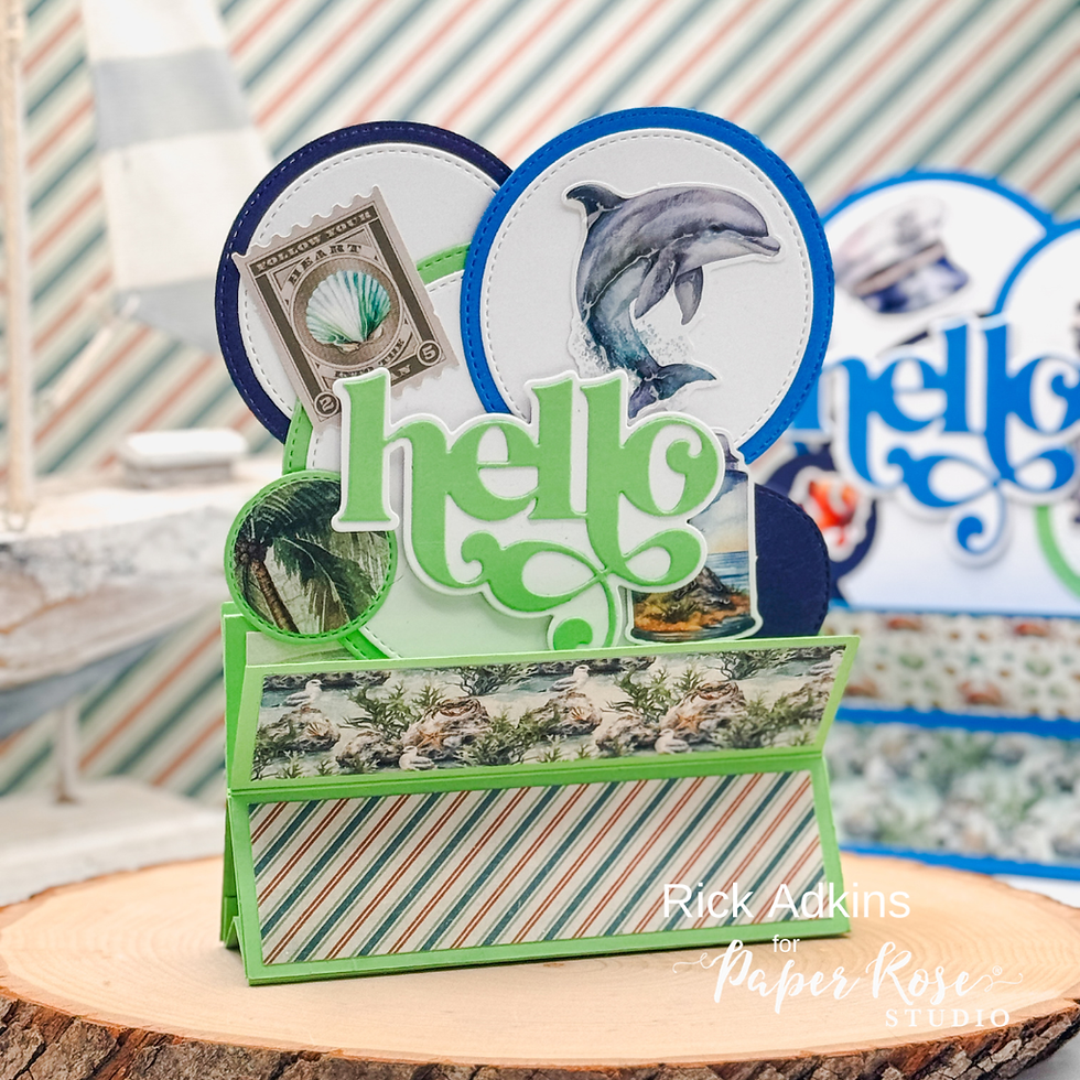 Card with "hello" text, featuring dolphin and seashell designs. Vibrant greens and blues, against a striped background.