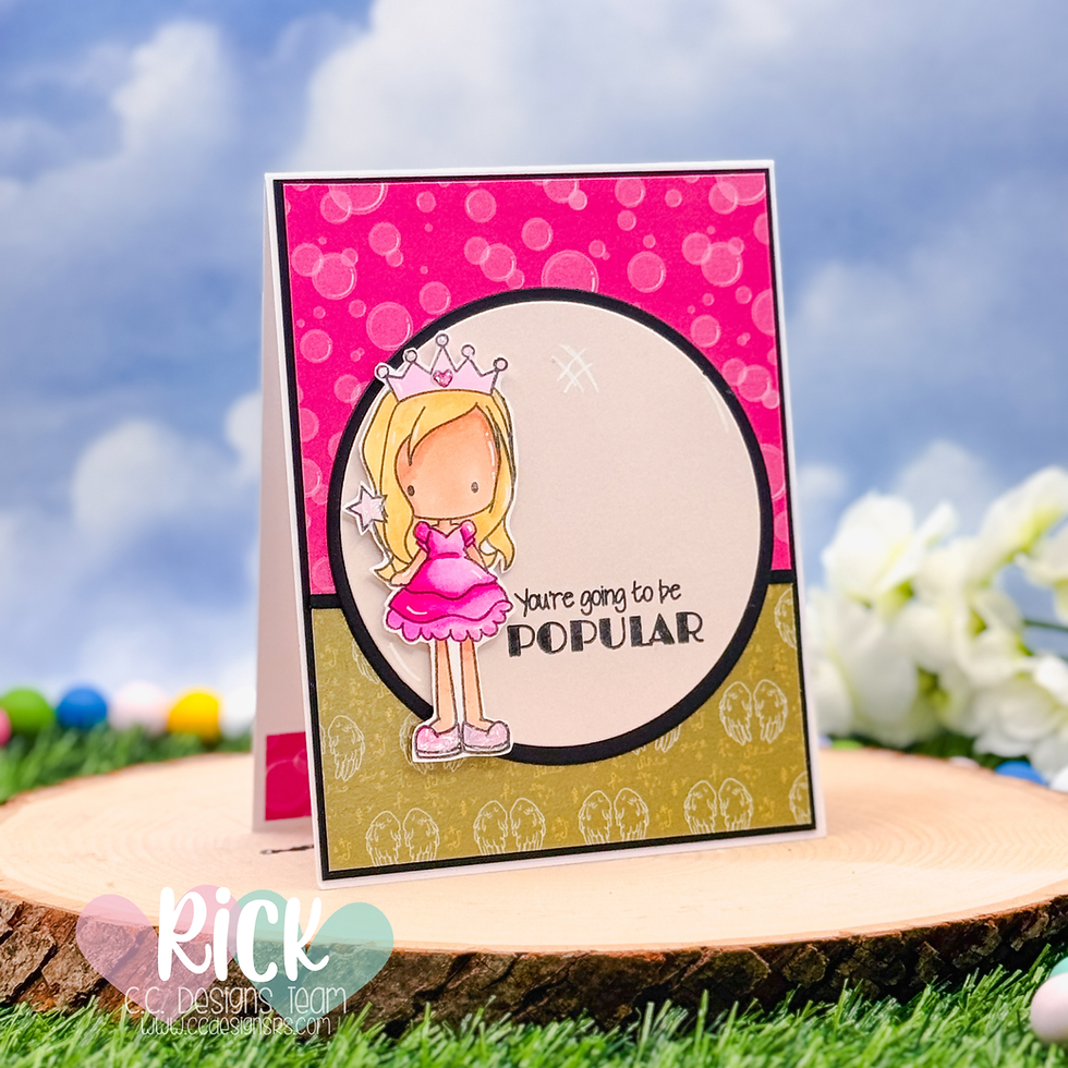 Cute card with a blonde girl in a pink dress and tiara. Text reads "You're going to be popular." Bright bokeh and floral background.