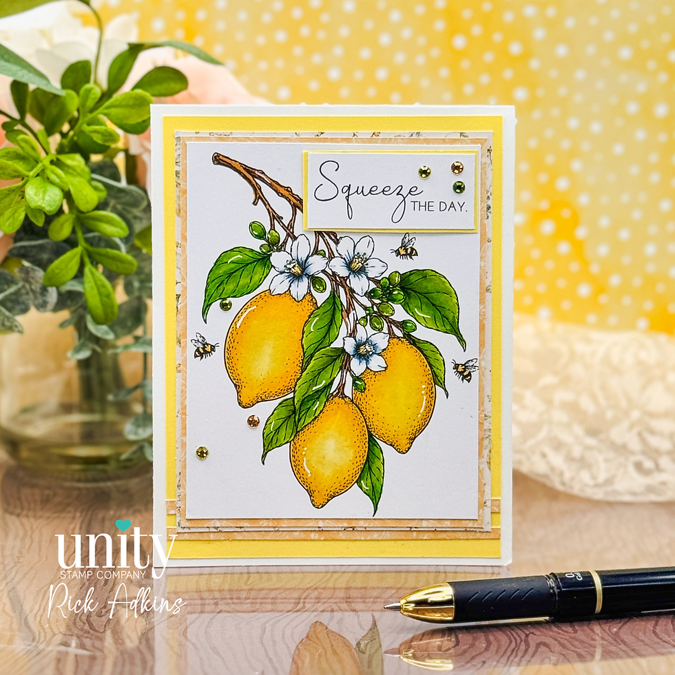 Handmade lemon card with flowers and bees on a tabletop, reading Squeeze the Day, beside a black pen and yellow polka-dot backdrop.