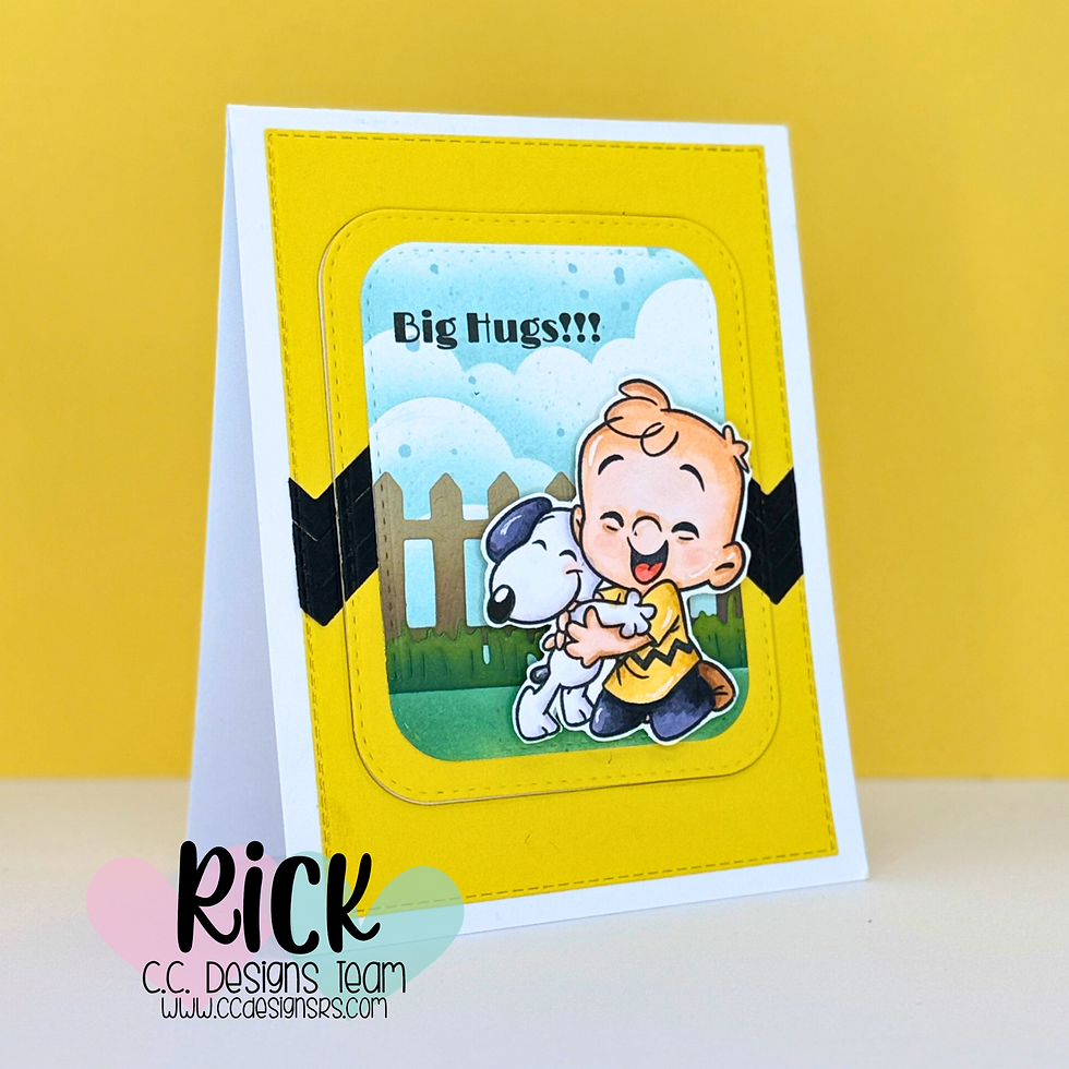 Card with a cheerful child hugging a dog against a picket fence. Text reads “Big Hugs!!!” Yellow border, black chevrons, logo "Rick" below.