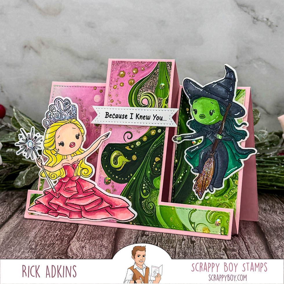 A pink card features Glinda with a wand and a Elphaba on a broomstick. Text reads "Because I Knew You." Sparkling details adorn it.
