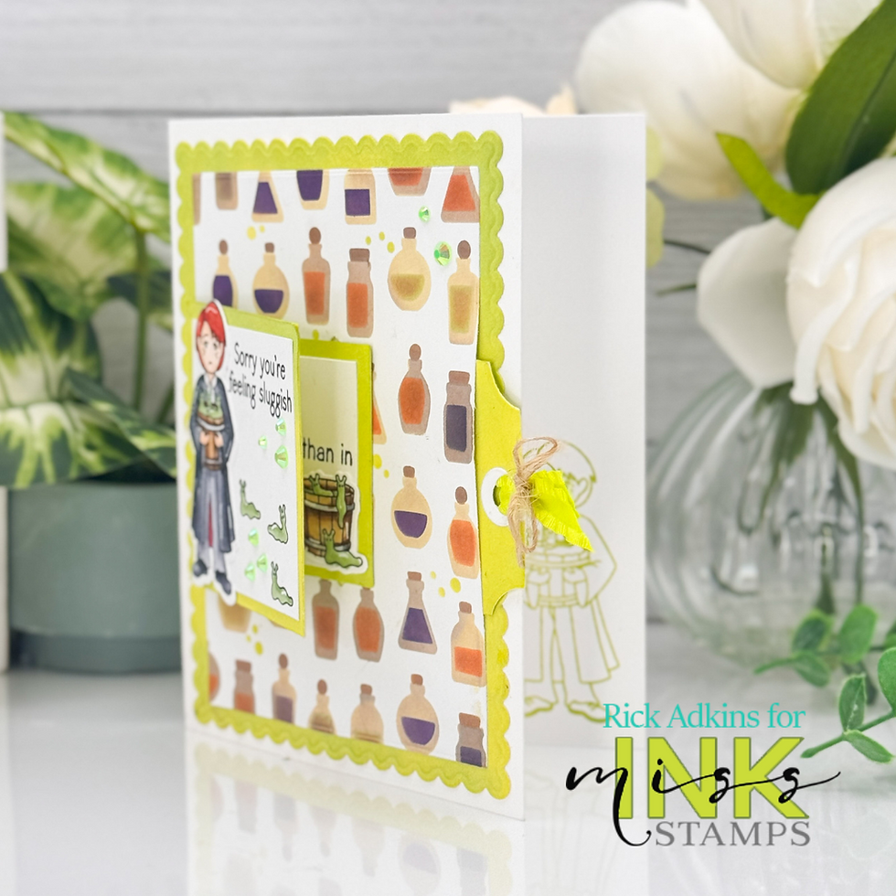 Greeting card with colorful potion bottles and a green border. Text says "Sorry you're feeling sluggish." White background with flowers.