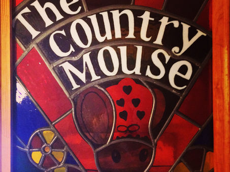 Image of the Country Mouse stain glass window