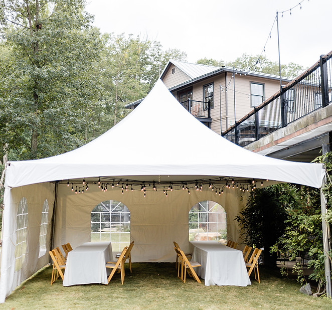Tent setup for an outdoor wedding at Ashton Creek vineyard