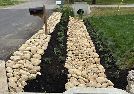 Pigeon River rock swale installation for drainage and erosion control.