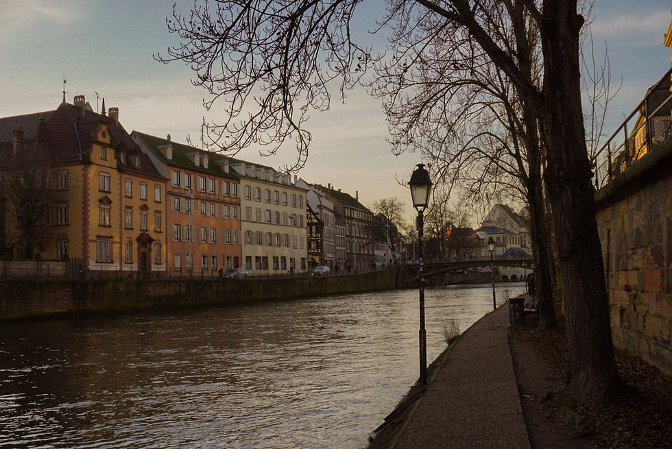 Colorful building lining the riverwalk of Strasbourg, France