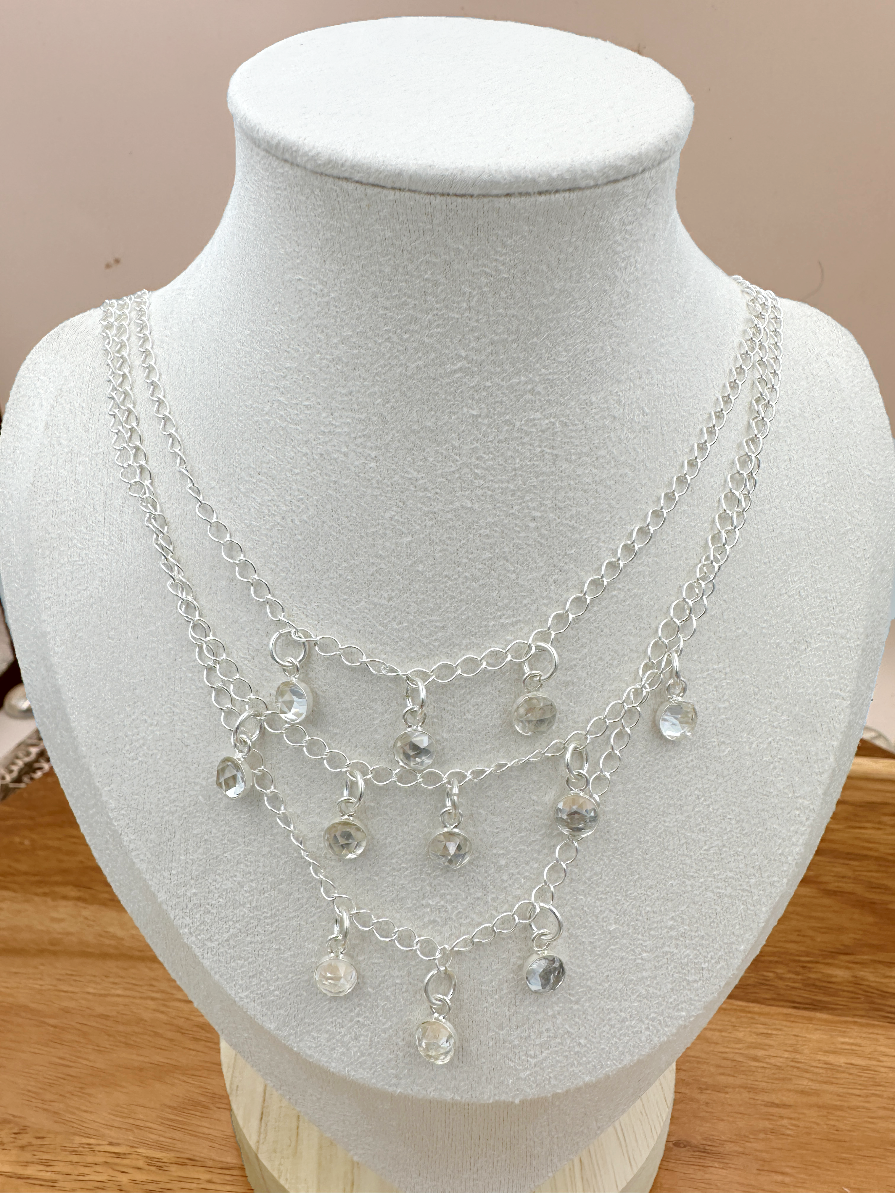 3 strand silver chain necklace with 11 white topaz cabs