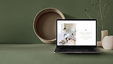 Laptop showing healing frequencies website design for sound therapist, on minimalist green background – Builth Wells, Wales.