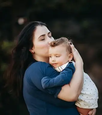 a mom of a new born child healing with post partum trauma