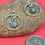 Thumbnail: Handmade silver tone earrings with wire wrap and turquoise color accent.