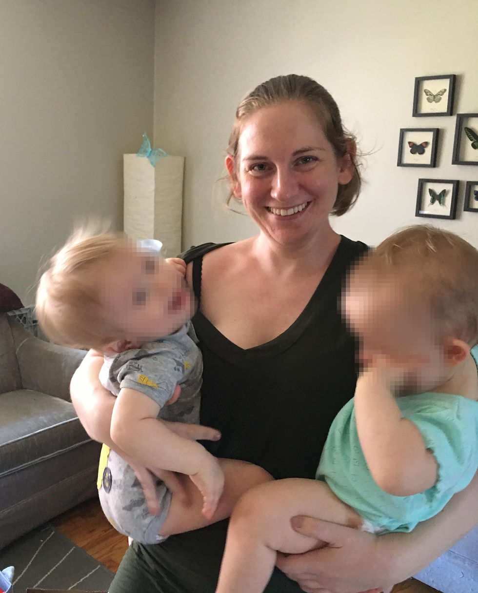 Whitley Savage holding two babies