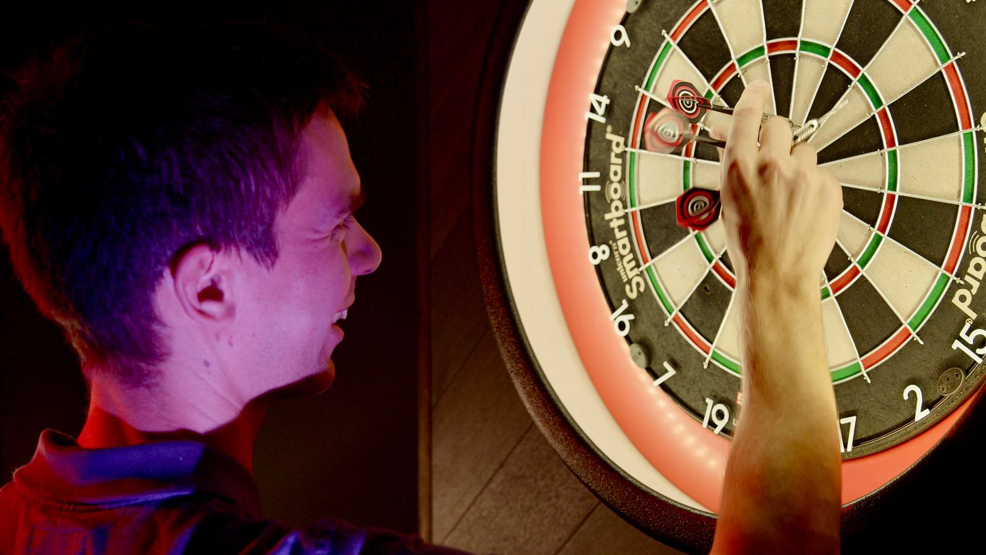 A woman playing AR darts