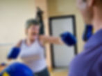 A woman attending a boxercise class