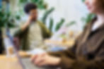A young man on the phone at a café