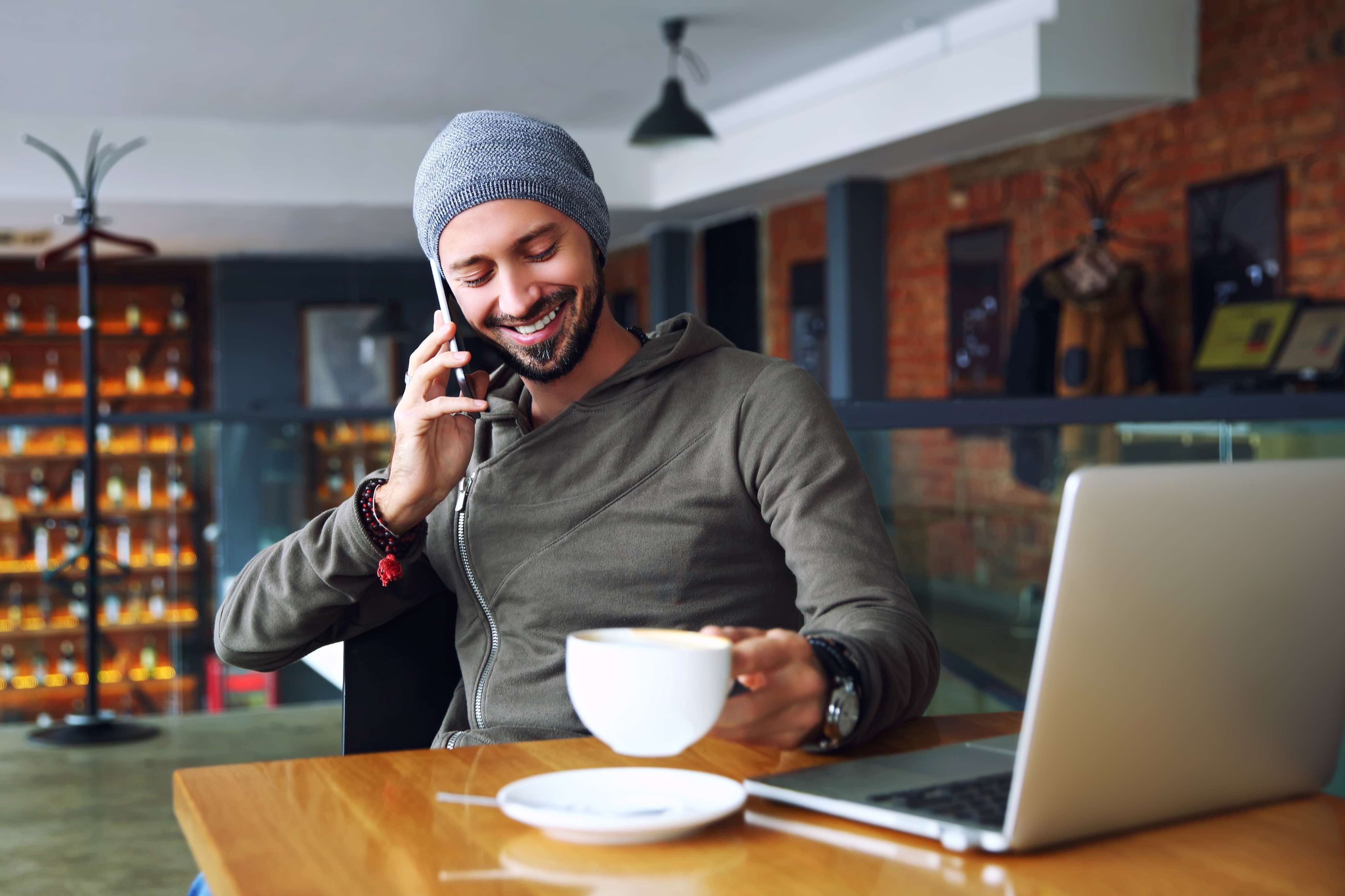 A man on the phone at a café
