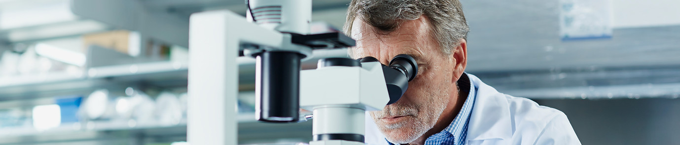 Scientist using microscope_edited.jpg