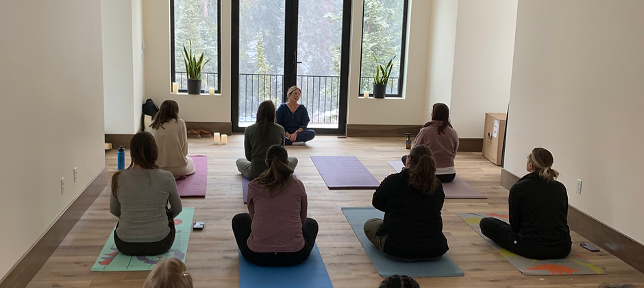 Group yoga in the multi-purpose room