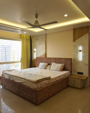 Warm Master Bedroom with Integrated Cove Lighting and Floating Side Tables in Balewadi Pune | Verb Interior