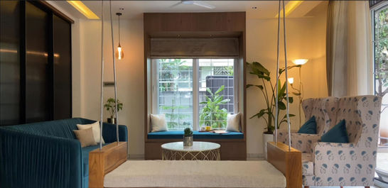 Luxury Living Room with Deep Blue Sofa and Indoor Swing in Kalyani Nagar Pune | Verb Interior