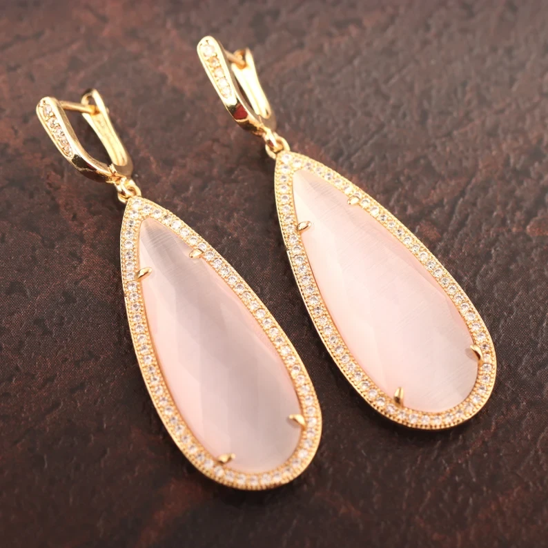 Thumbnail: Gold Drop Earrings in Rare Pink Cat's Eye
