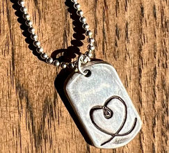 Sterling Silver Pendant with everlasting heart with small tear inside