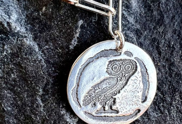 Owl image on silver pendant