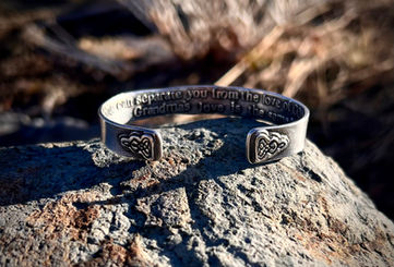 Sterling Silver Cuff bracelet with the celtic Grandmother knot on each end of the cuff
