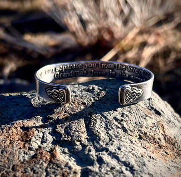 Sterling Silver Cuff bracelet with the celtic Grandmother knot on each end of the cuff