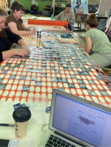 Figure 6. The gluing of the cyanotypes with Lesley, 2026, photograph by Indy Marsden