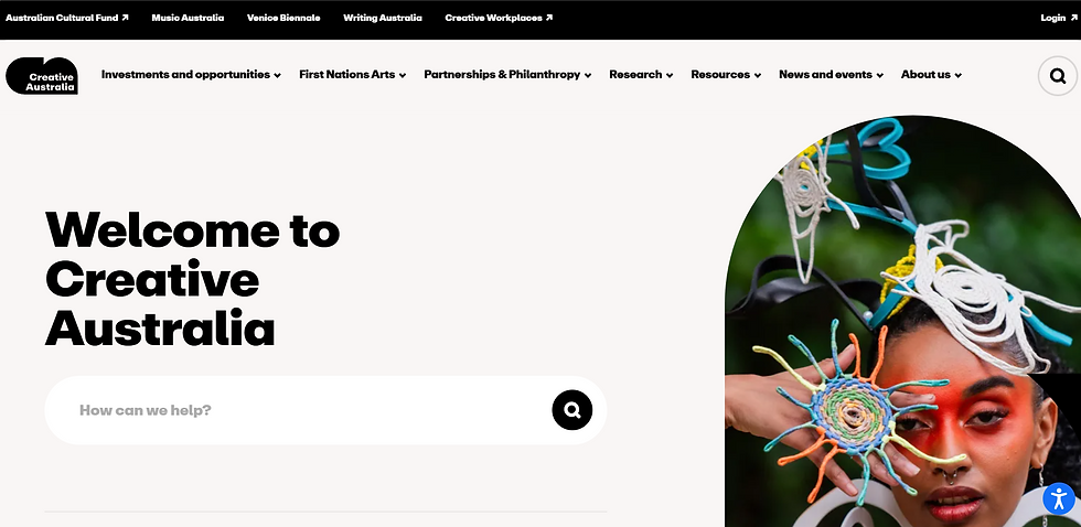 Creative Australia's homepage with "Welcome" text. A colorful headdress and hand accessory frame a person's face. Bold design with black menu.