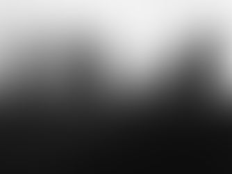 Blurred silhouettes of five figures stand on a dark field with a foggy, white background, creating a mysterious and eerie mood.