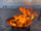 family enjoying a san diego beach bonfire