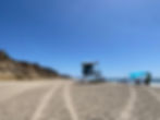 view of lifeguard tower on a calm fall beach day at solana beach's fletcher cove beach