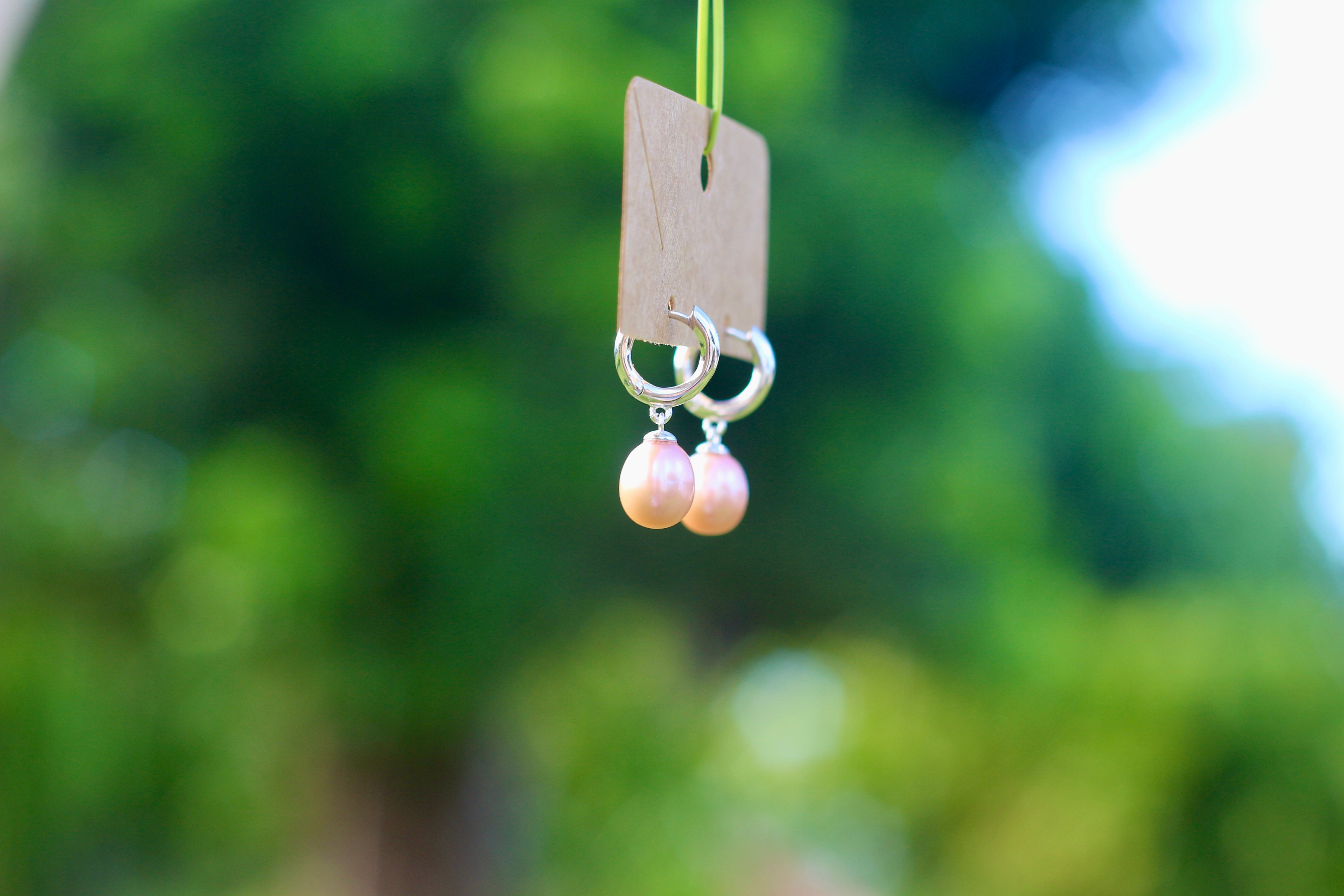 Pink pearl huggie drops