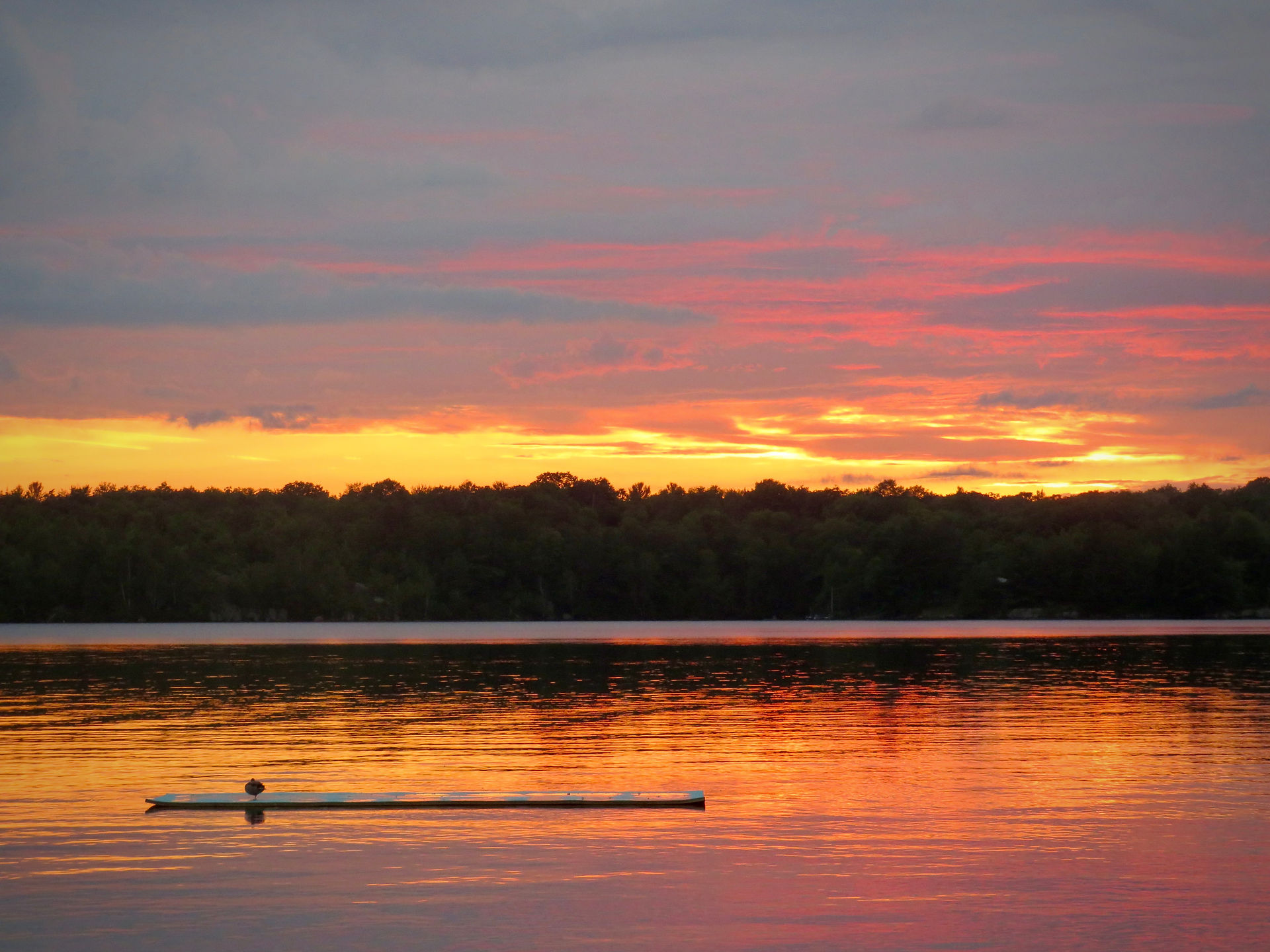 Colourful sunset reflecting over a lake