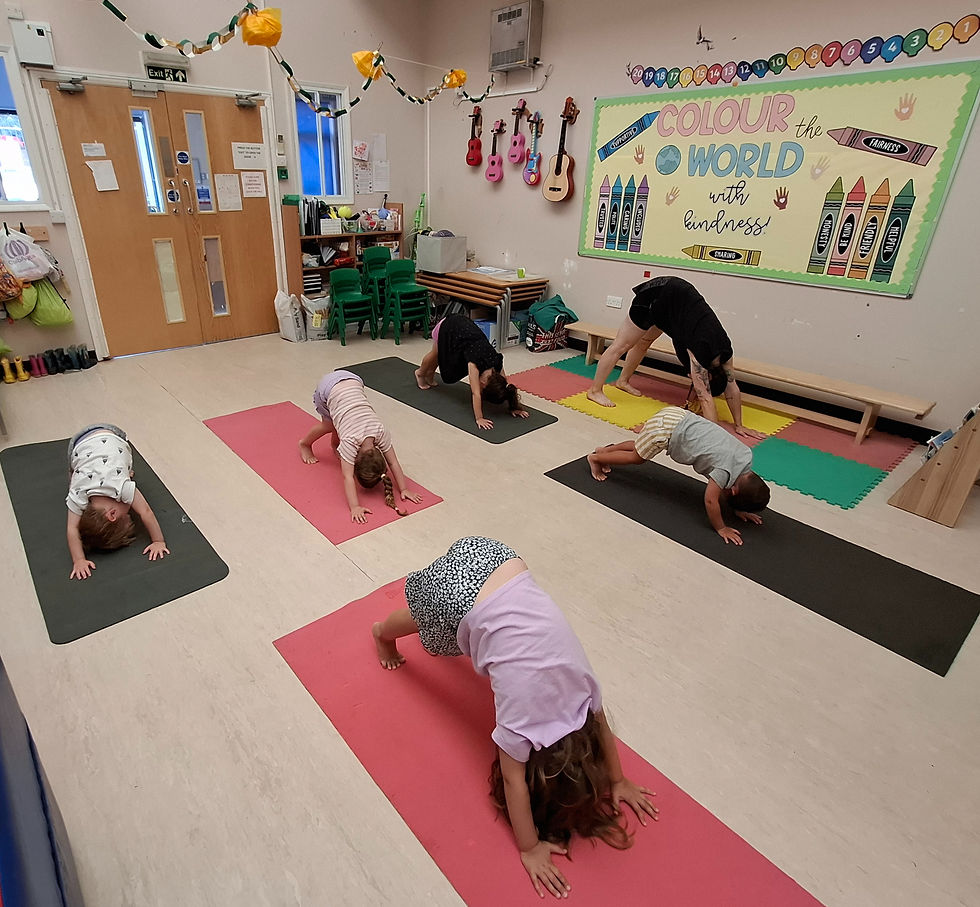 Children at Kidz Kabin Pembroke Studios nursery taking part in yoga