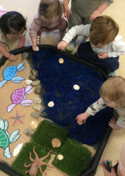 Kidz Kabin Nursery Pembroke Studios Muswell Hill - children playing with an under the sea tuff tray