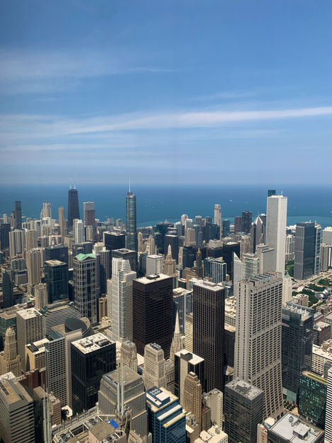 View of Chicago architecture and Lake Michigan from Skydeck, clear blue sky, iPhone image.