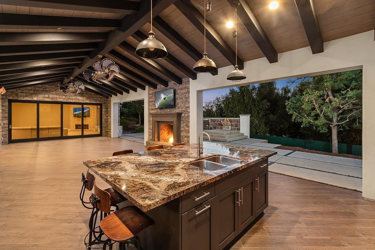 Weatherproof outdoor cabinets with a granite countertop