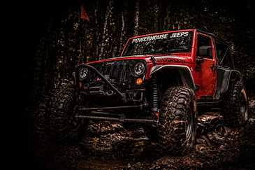 Custom stretched Jeep JK crawler with 42 inch tires, coilover suspension, and heavy-duty axles
