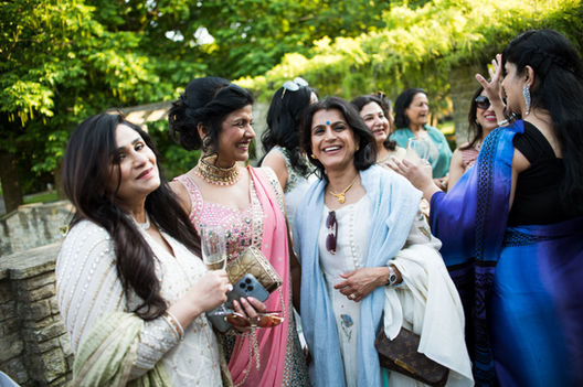 Vibrant decorations and smiling guests at a lively event, taken during a party photography London session