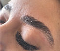 Close up brow lamination and hybrid lash extensions on a client from auburn bay