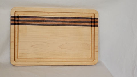 Cutting board with Maple, with walnut and cherry stripes and a juice groove