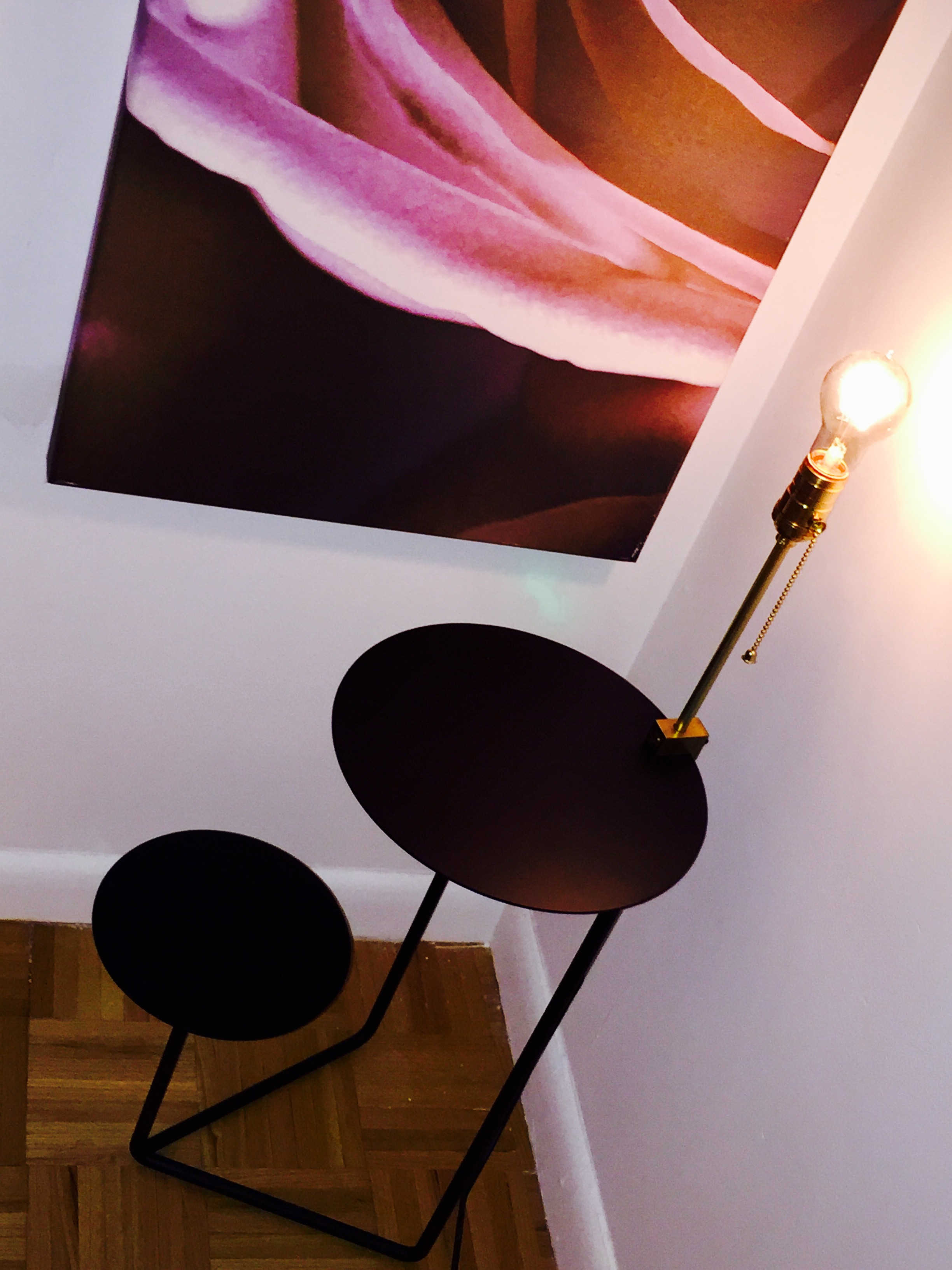 Round bedside with brass lamp