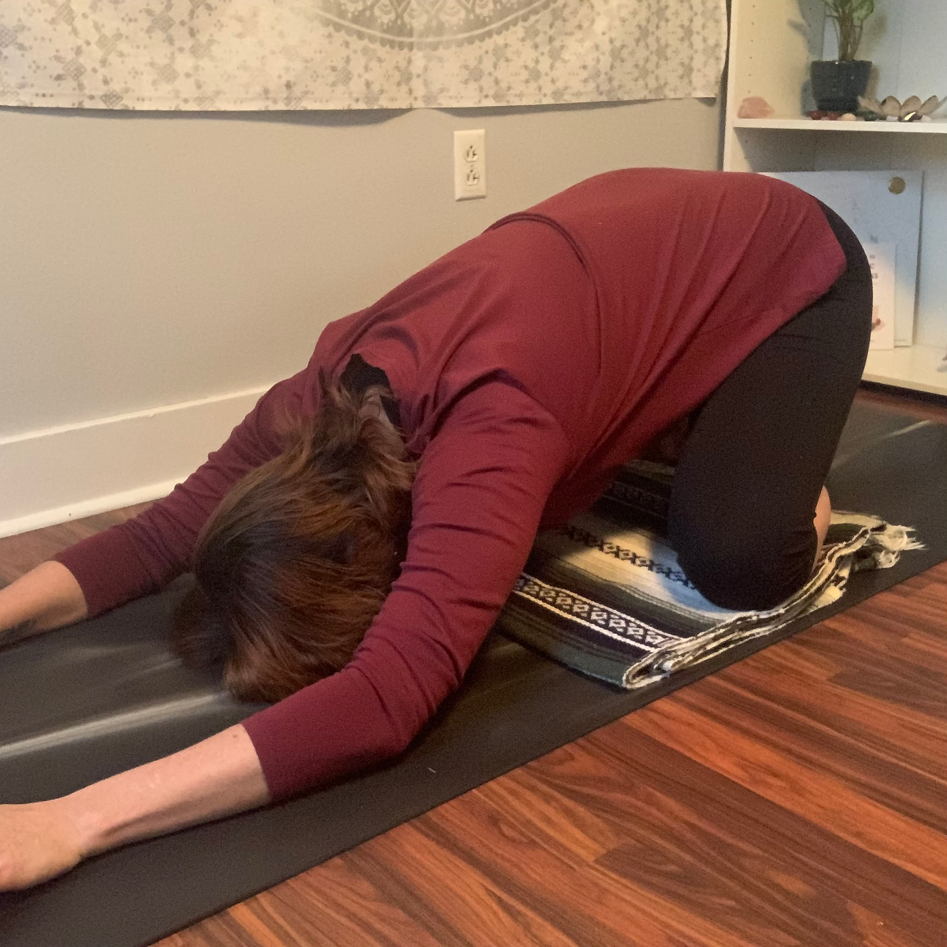 Woman in Childs Pose (yoga)
