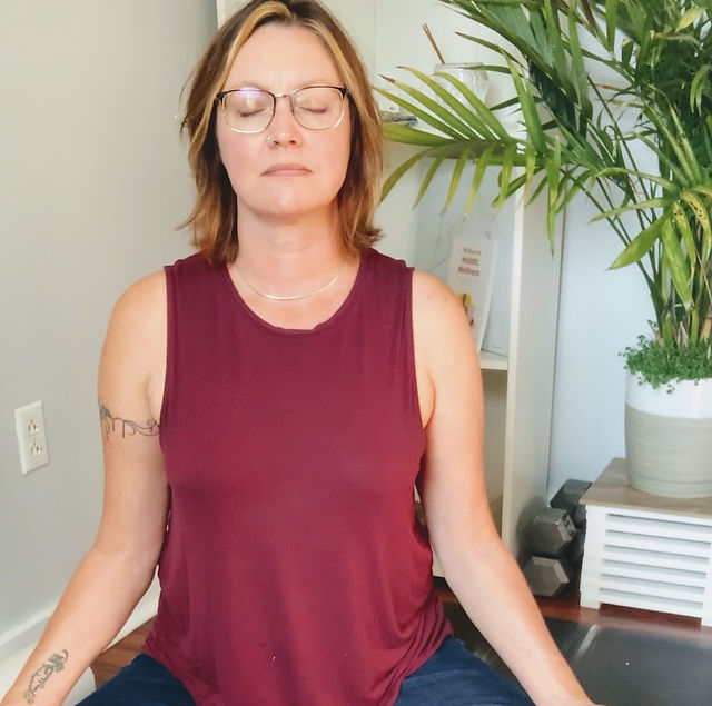woman meditating in traditional position