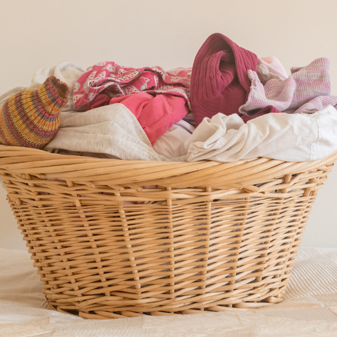 wicker laundry basket full of laundry