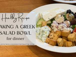 greek salad bowl on a wooden cutting board